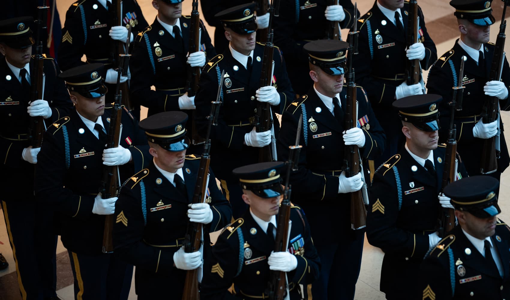 Members of the military stand as US President Donald Trump reviews the troops in Emancipation Hall during inauguration ceremonies at the US Capitol in Washington, on January 20, 2025.
