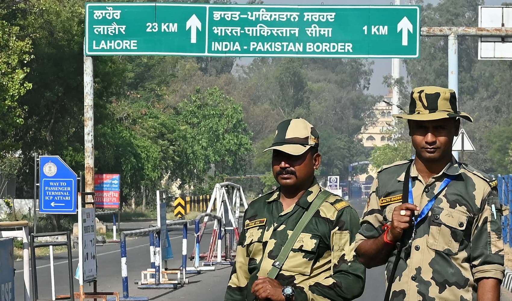Indian Border Security Force (BSF) soldiers stand guard at the entrance of the India-Pakistan Wagah border post, about 35kms from Amritsar on April 24, 2025. India took a raft of punitive diplomatic measures against Pakistan on April 23, accusing Islamabad of supporting “cross-border terrorism” after a deadly attack on civilians in Kashmir. (Photo by Narinder NANU / AFP) (Photo by NARINDER NANU/AFP via Getty Images)